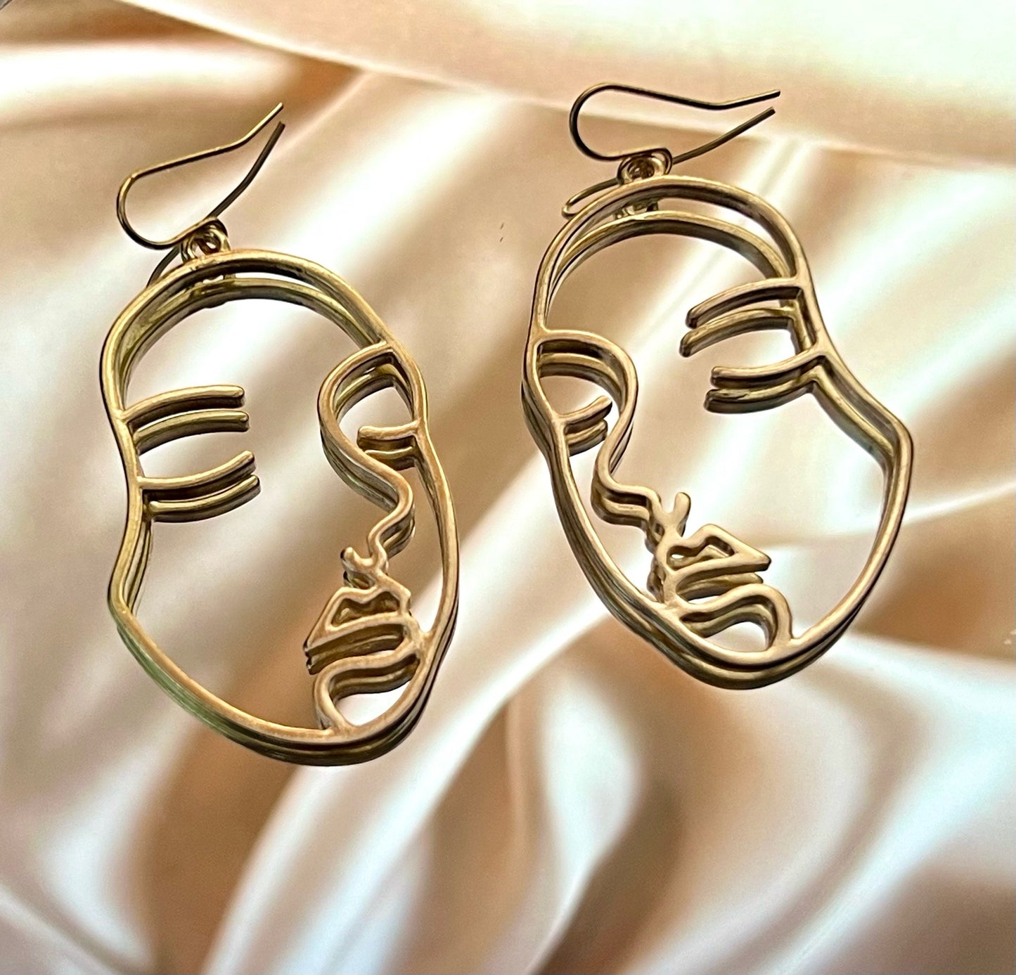 Boucles d'oreilles visages lineart